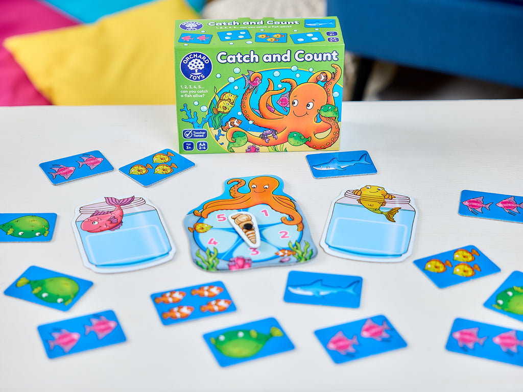 Children's educational game 'Catch and Count' with cards and packaging on a colorful background