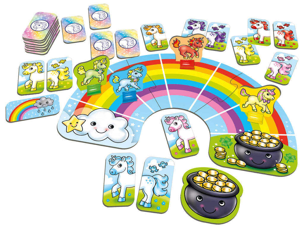 Children's game with colorful cards and a rainbow-shaped board on a white background