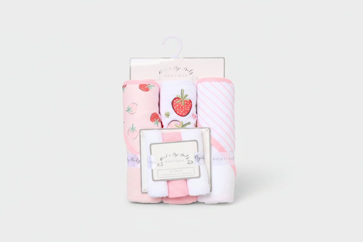 Set of baby blankets with strawberry pattern in packaging on a white background