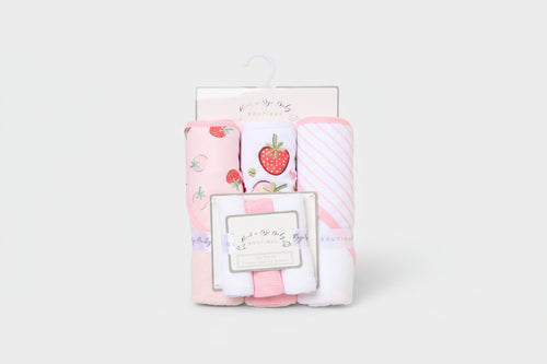 Set of baby blankets with strawberry pattern in packaging on a white background