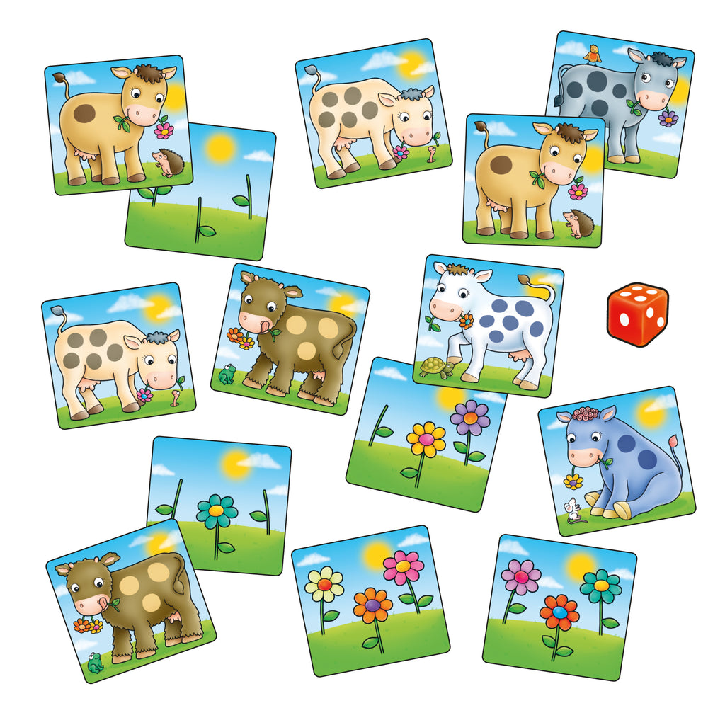 Set of colorful cow-themed game cards with a die on a white background