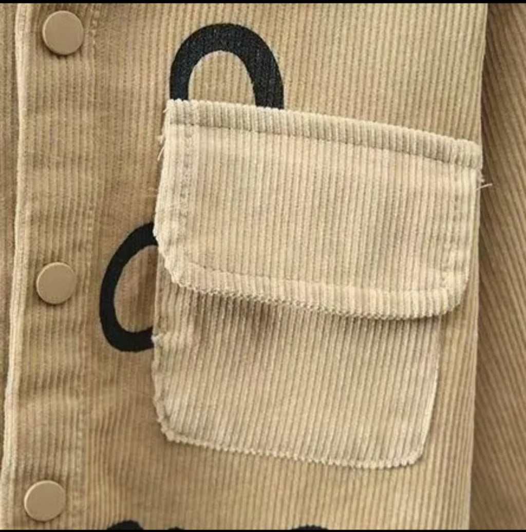 Beige corduroy jacket with a pocket and black handle