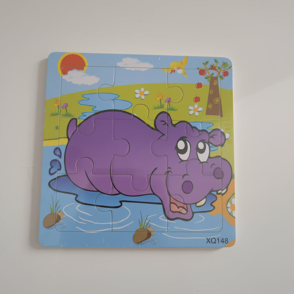 Children's puzzle with a purple hippo design on a colorful background