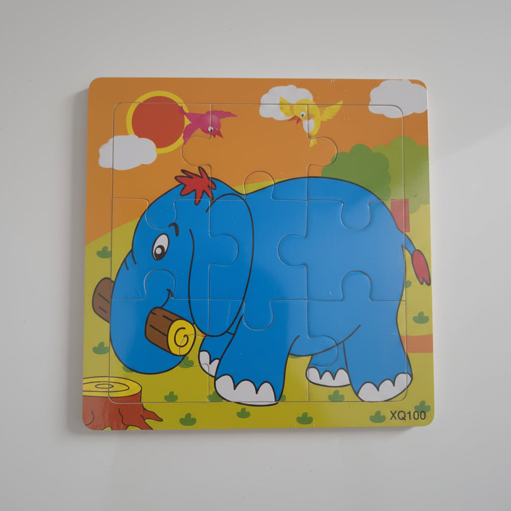 Children's puzzle with a blue elephant design on an orange background