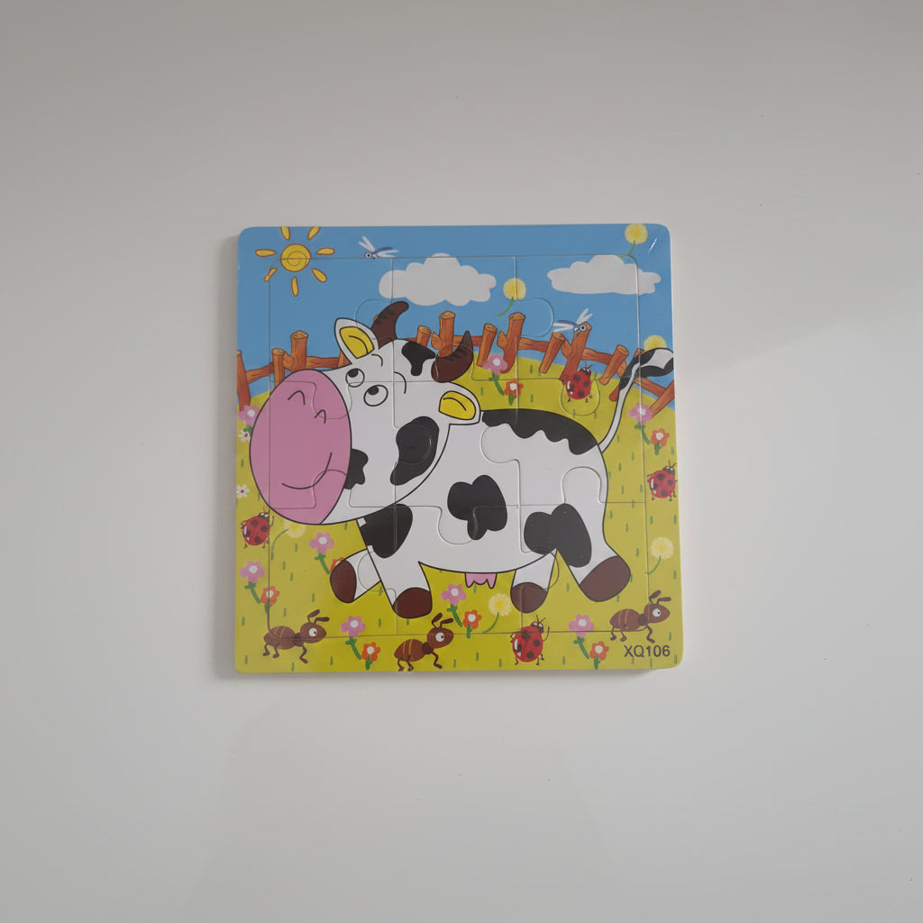 Children's puzzle with a cow design on a plain background