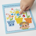 Child's finger painting colourful petals on Cocomelon activity page